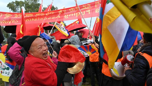 China supporters and anti-China protesters outside Parliament House in Canberra on Monday. Picture: AAP