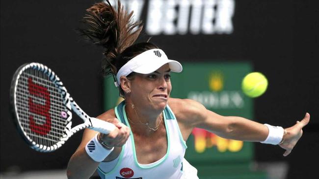Ajla Tomljanovic makes a forehand return to Spain's Garbine Muguruza during their second-round match at the Australian Open on Thursday. Picture: Dita Alangkara/AP