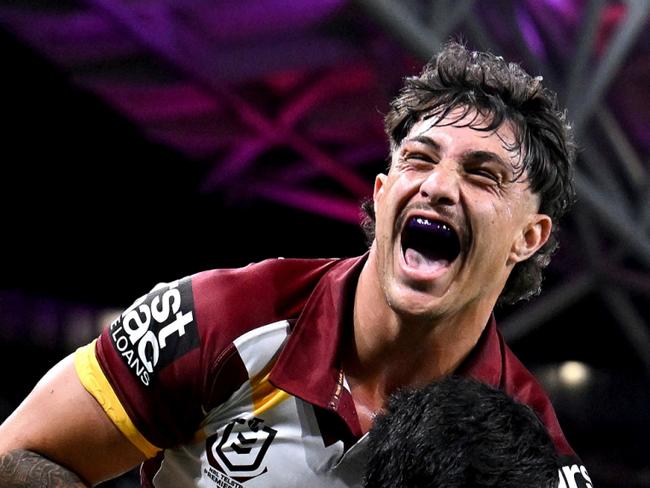 BRISBANE, AUSTRALIA - MAY 17: Kotoni Staggs of the Broncos jumps on Deine Mariner of the Broncos as they celebrate Deine Mariner scoring a try during the round 11 NRL match between Manly Sea Eagles and Brisbane Broncos at Suncorp Stadium, on May 17, 2024, in Brisbane, Australia. (Photo by Bradley Kanaris/Getty Images)