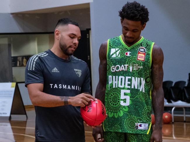 Jarman Impey teaches South East Melbourne Phoenix American import Xavier Munford the complexities of the Sherrin. Picture: SEM Phoenix Media