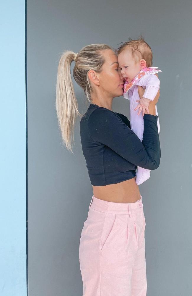 Ashy Bines, a fitness influencer, clapped back after a woman said it was ‘wrong’ to leave her daughter with her dad. Picture: Instagram/AshyBines