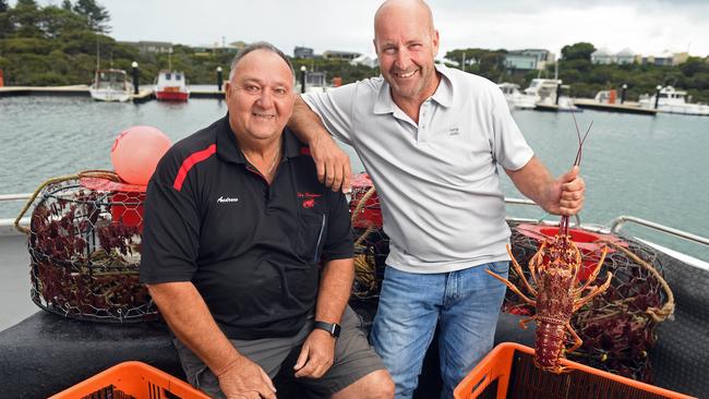 Sky Seafoods owner Andrew Lawrie and commercial rock lobster fisherman Paul Regnier at the Robe Marina. Picture: Tom Huntley