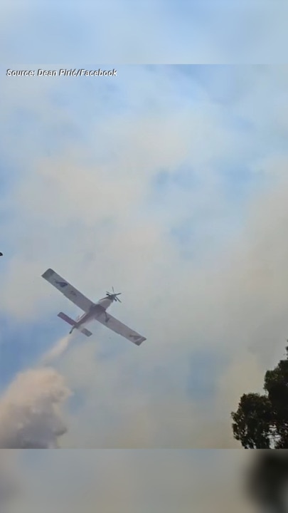 Grassfire threatening homes near Munno Para Shopping Centre