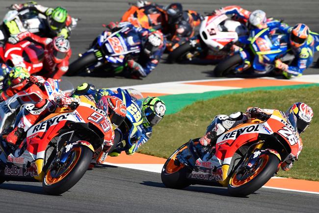 Marquez fought off an early challenge from Pedrosa, before letting Zarco through to the lead.