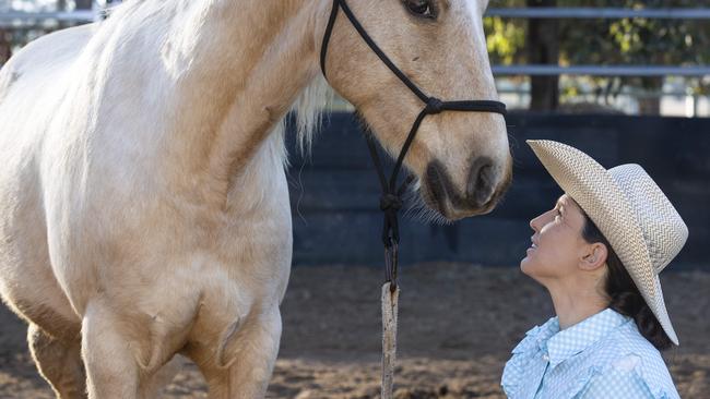 Horse Trainer Elle Moro with a horse in training named Trevor. Picture: Zoe Phillips