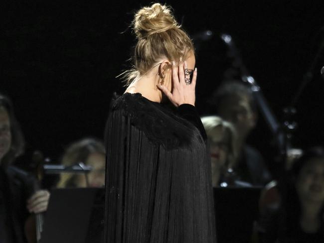 Horrified: Adele apologises before restarting a performance tribute to George Michael at the 59th annual Grammy Awards. Picture: Matt Sayles/Invision/AP