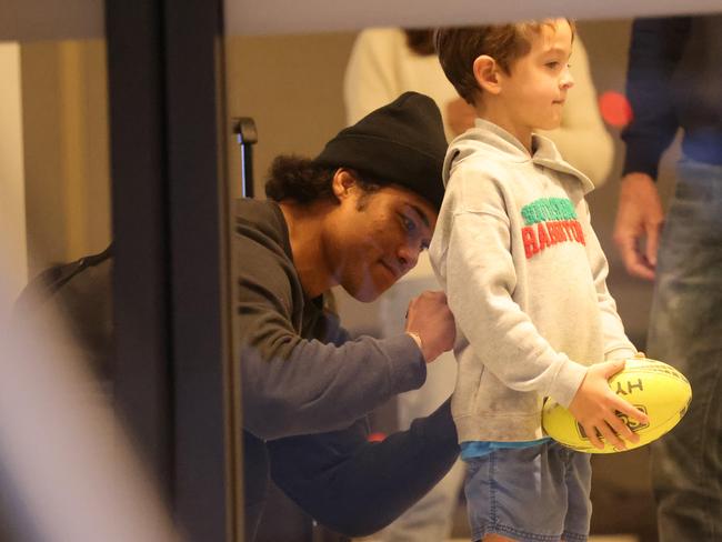 Brian To’o signs a young fan’s jumper. Picture: Damian Shaw