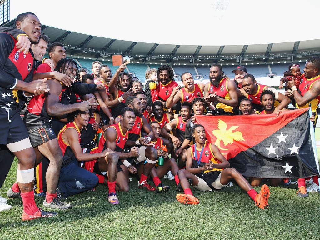 The PNG team celebrate winning the 2017 AFL International Cup Grand Final. Picture: Michael Dodge/Getty Images