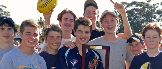 Liam Stocker with the Chris Judd Perpetual Trophy