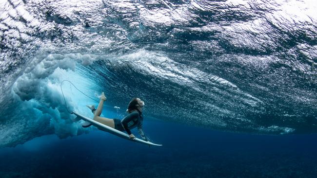 Australian surfer Olivia Ottaway dives under a wave on August 19, 2023 in Teahupo'o, French Polynesia. Teahupo'o has been hosting the WSL Tahiti Pro event for over two decades and will next year host the surfing event for the Paris 2024 Olympic Games. Picture: Ryan Pierse/Getty Images