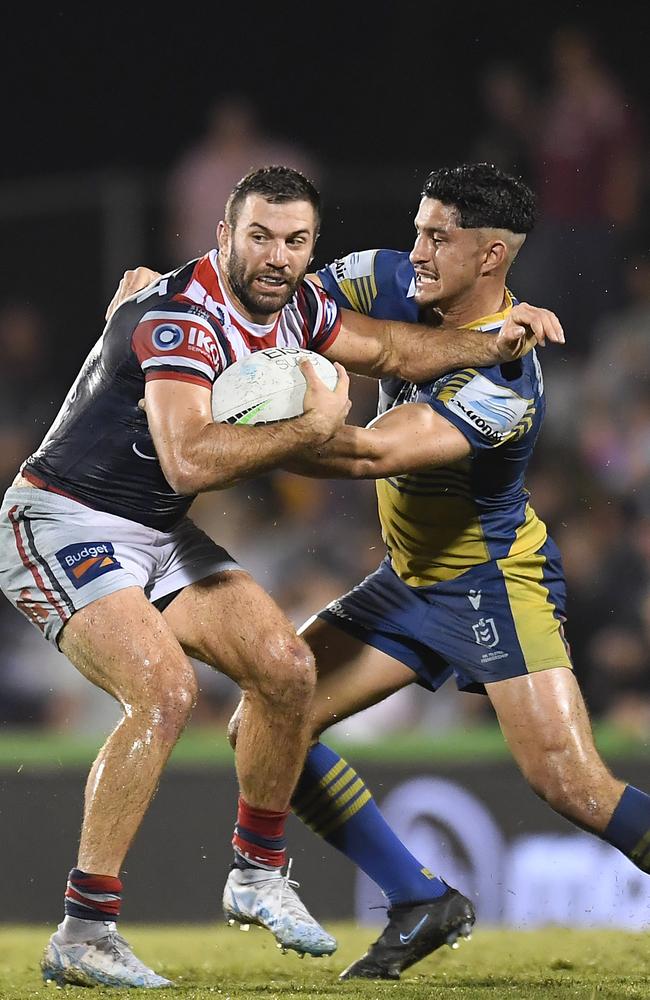 MACKAY, AUSTRALIA - JULY 29: James Tedesco of the Roosters is tackled during the round 20 NRL match between the Sydney Roosters and the Parramatta Eels at BB Print Stadium, on July 29, 2021, in Mackay, Australia. (Photo by Albert Perez/Getty Images)