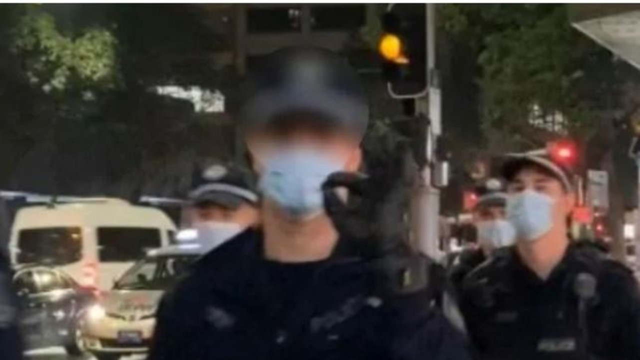 A NSW Police officer was filmed making the same gesture at protesters months later and offered a similar explanation.