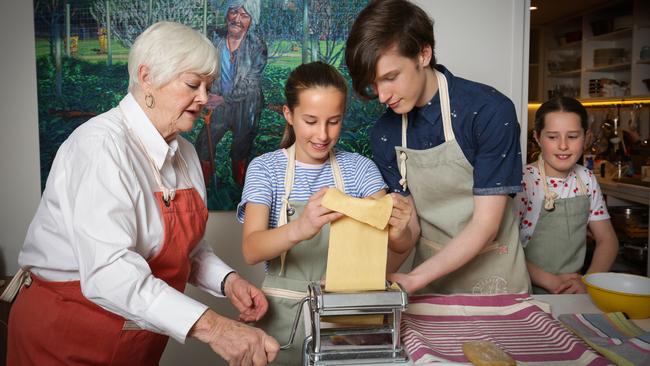 Stephanie Alexander in her kitchen garden with kids Riley, Clara and Lucy. Picture: Nicole Cleary