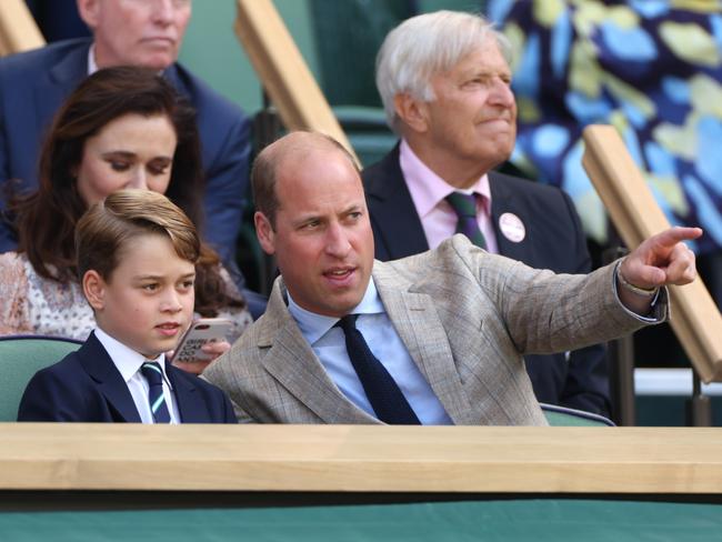 Prince William and his mini-me chat during the Wimbledon final. Picture: Getty Images