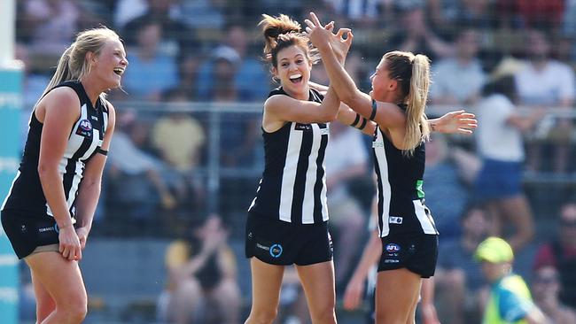 Stephanie Chiocci celebrates with teammates after Collingwood’s first win for the AFLW season. Picture: Getty Images