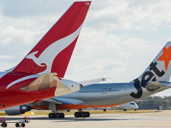 ESCAPE: Jetstar and Qantas aircraf tails. Picture: Jetstar