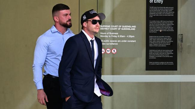 Will Warren (right) leaves the Supreme Court in Brisbane. He was sentenced for viciously smashing an elderly man’s car with a baseball bat. Picture: Dan Peled / NCA NewsWire