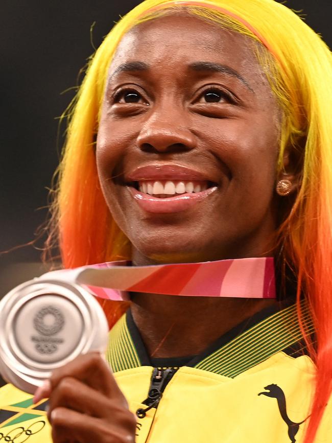 Shelly-Ann Fraser-Pryce: Famous for changing her hair colour, the 100m star went for the rainbow look to collect her silver medal