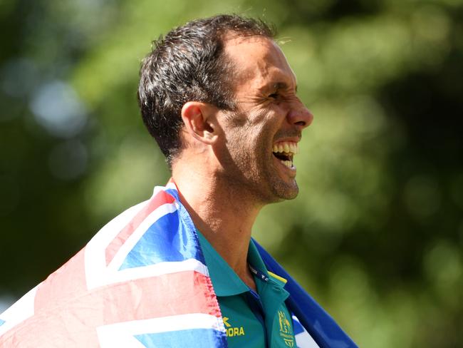 Hockey captain Mark Knowles poses for photographs with  a flag after being announced as the flag bearer for the Australian team at the XXI Commonwealth Games, at the Gold Coast, Australia, Tuesday, April 3, 2018. (AAP Image/Tracey Nearmy) NO ARCHIVING, EDITORIAL USE ONLY