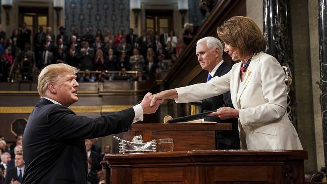 President Donald Trump shakes hands with House Speaker Nancy Pelosi. Picture: AP.