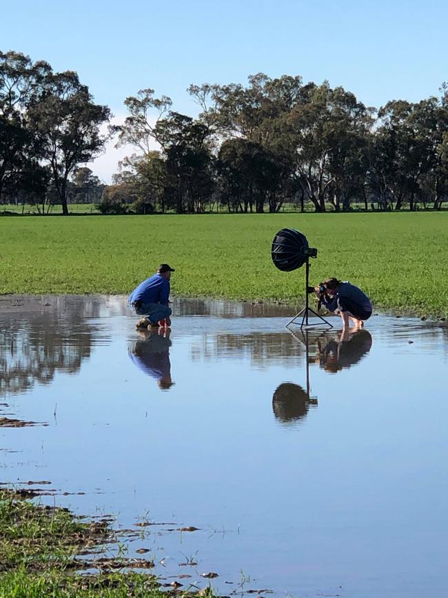 Zoe Phillips taking a shot of grain grower Andrew Russell.