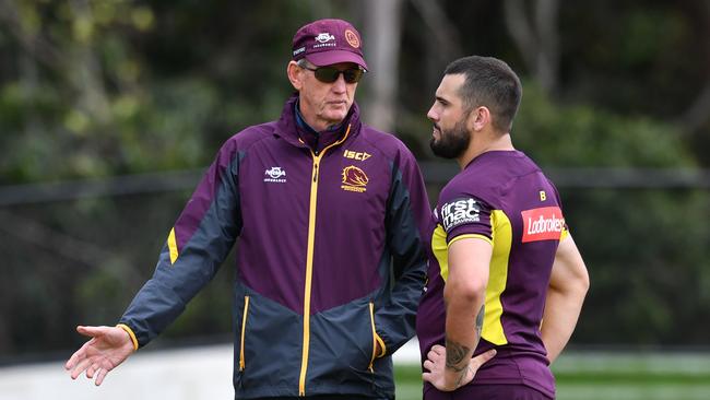 Wayne Bennett and Jack Bird speak during Broncos training.