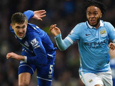 MANCHESTER, ENGLAND - JANUARY 13: Raheem Sterling of Manchester City and John Stones of Everton compete for the ball during the Barclays Premier League match between Manchester City and Everton at the Etihad Stadium on January 13, 2016 in Manchester, England. (Photo by Laurence Griffiths/Getty Images)