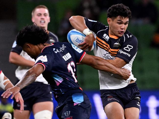 Brumbies' Noah Lolesio (R) is tackled by the Rebels' David Feliuai (L) during the Super Rugby match between the Melbourne Rebels and the ACT Brumbies on February 23, 2024. Picture: AFP