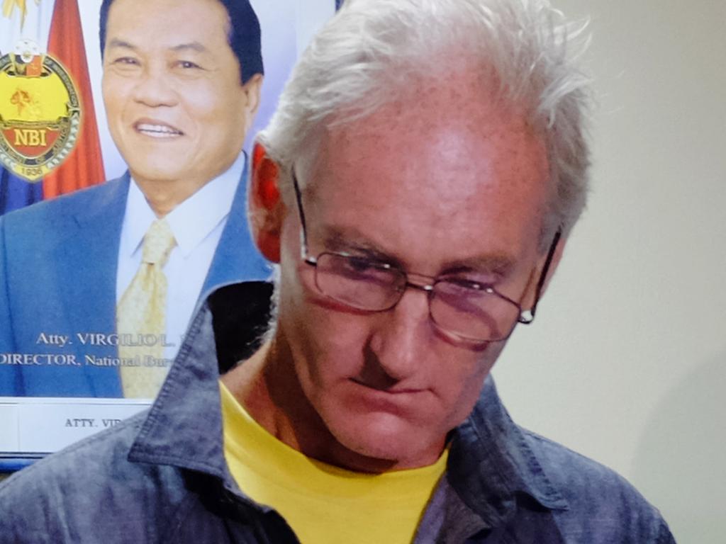 In this photo taken on February 21, 2015, Australian national Peter Scully, who allegedly sexually assaulted babies and children, stands while being presented at the National Bureau of Investigation (NBI) in the Philippines.