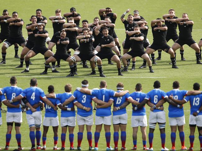 New Zealand's players perform the haka against Namibia. (Photo by Odd ANDERSEN / AFP)