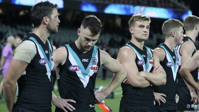 Travis Boak, Robbie Gray and Ollie Wines after Port Adelaide’s loss. Picture: Sarah Reed