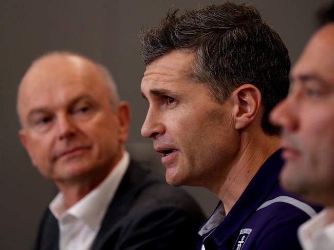 Fremantle Dockers senior coach Justin Longmuir at a press conference announcing he would be the new coach in 2019 alongside President Dale Alcock (left) and general manager of football Peter Bellin.