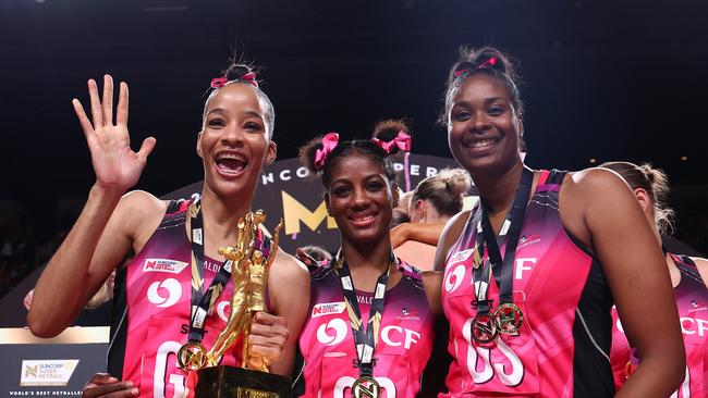 ADELAIDE, AUSTRALIA - AUGUST 03: (L-R) Shamera Sterling-Humphrey, Latanya Wilson and Romelda Aiken-George of the Thunderbirds  celebrate victory in the Super Netball Grand Final match between Adelaide Thunderbirds and Melbourne Vixens at Adelaide Entertainment Centre on August 03, 2024 in Adelaide, Australia. (Photo by Graham Denholm/Getty Images)