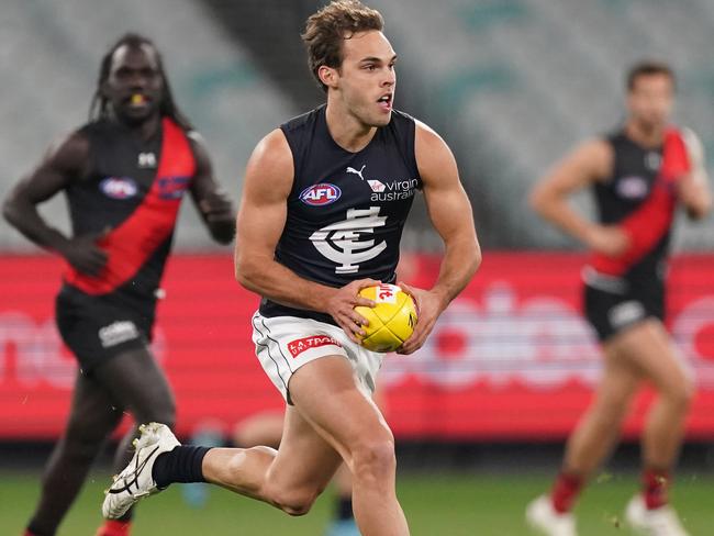 David Cuningham of the Blues runs with the ball during the Round 4 AFL match between the Essendon Bombers and the Carlton Blues at the MCG in Melbourne, Saturday, June 27, 2020. (AAP Image/Michael Dodge) NO ARCHIVING, EDITORIAL USE ONLY