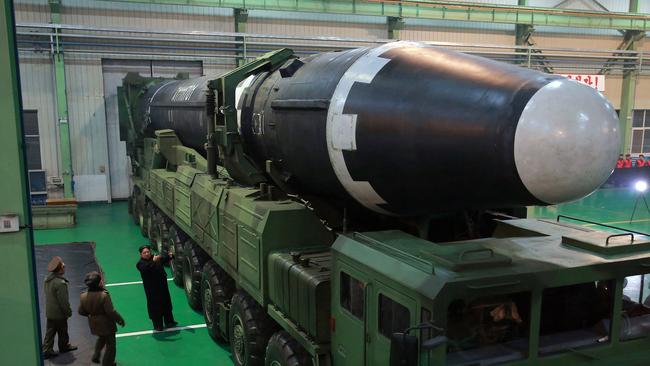 Kim Jong-un, third from left, inspects what the North Korean government calls the Hwasong-15 intercontinental ballistic missile. Picture: AP/KCNA