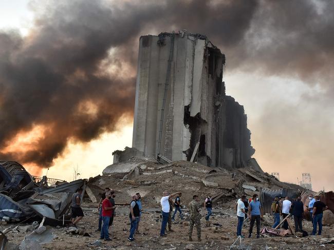 TOPSHOT - EDITORS NOTE: Graphic content / A picture shows a destroyed silo at the scene of an explosion at the port in the Lebanese capital Beirut on August 4, 2020. - Two huge explosion rocked the Lebanese capital Beirut, wounding dozens of people, shaking buildings and sending huge plumes of smoke billowing into the sky. Lebanese media carried images of people trapped under rubble, some bloodied, after the massive explosions, the cause of which was not immediately known. (Photo by STR / AFP)