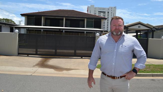 Aaron Power stands in front of the Townsville Holiday Apartments in North Ward bought by the Morris Group for just under $2m last year.