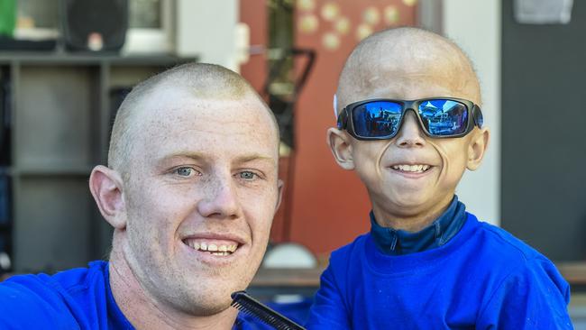 The end result – Glenelg star Josh Scott with his head and beard shaven by Enzo Cornejo. Picture: AAP/Roy VanDerVegt