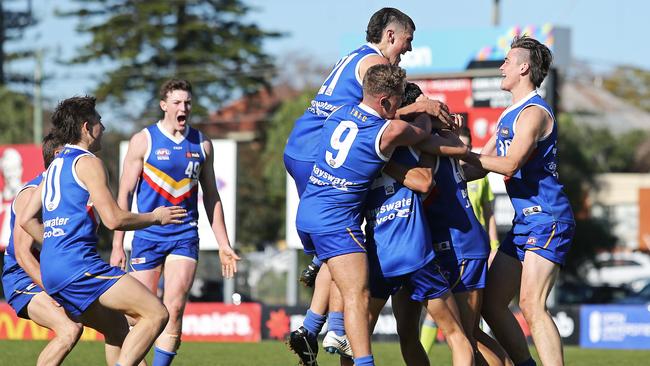 Eastern Ranges celebrate their win after the siren.