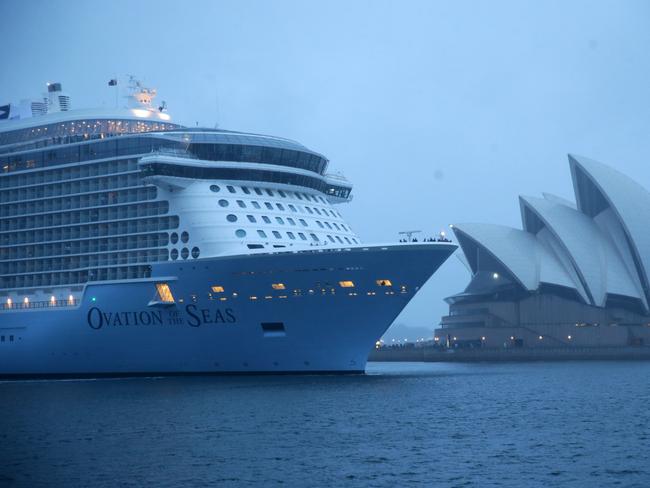 The massive cruise ship Ovation of the Seas has docked in Sydney during a cold wet morning. The rain didn't let up during it's arrival, but that didn't dampen the welcome from Sydney siders who braved the conditions. Pics Bill Hearne