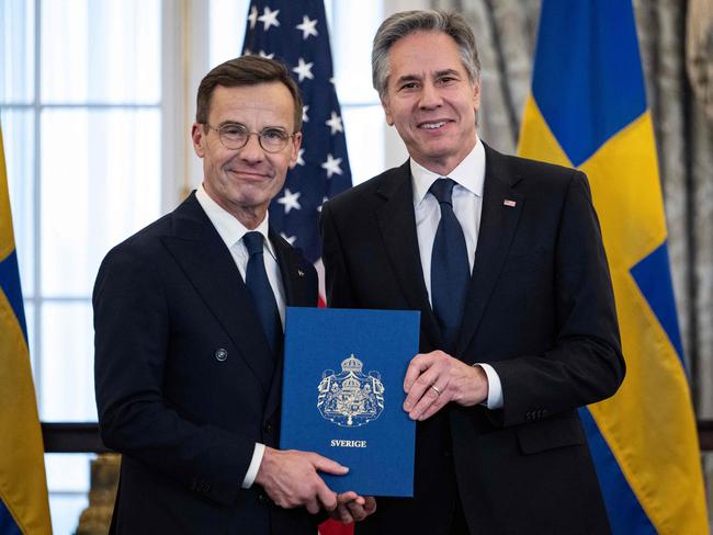US Secretary of State Antony Blinken receives the NATO ratification documents from Swedish Prime Minister Ulf Kristersson during a ceremony at the US State Department. Picture: AFP