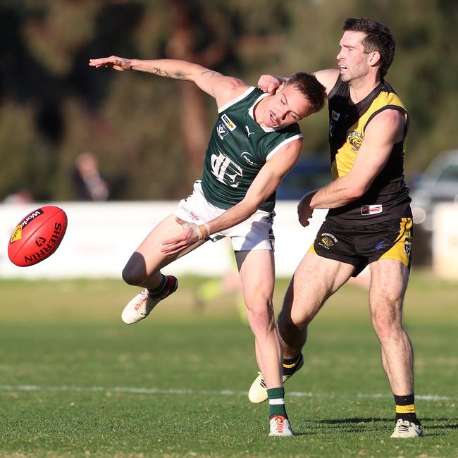 Rochester’s Nathan McCarty grabs Echuca’s Corbin Anderson high.