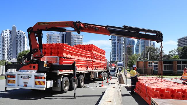 Police and Council workers yesterday installed large plastic retaining barriers blocking entry into Queensland from NSW through Tweed Heads after QLD closed its borders to Sydney residents due to other major Covid breakout. Photo: Scott Powick.