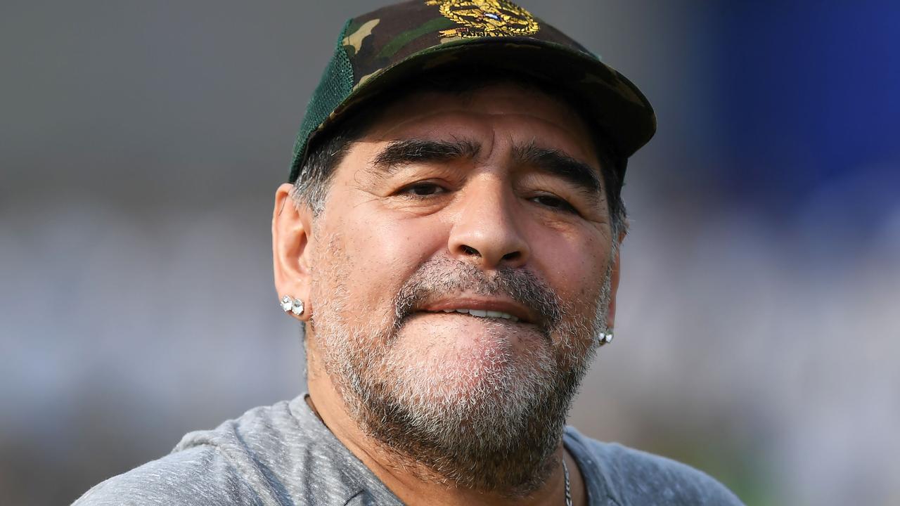 Eight medical personnel will stand trial for alleged criminal negligence in the death of Argentine football legend Diego Maradona. / AFP PHOTO / Dibyangshu SARKAR