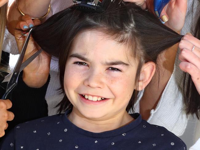 12yo Mason Boseley has been growing his hair and will have his head shaved to raise money for Andrew Love Cancer Centre, where his mum received treatment during her cancer journey. Left: Morgan Boseley 20yrs, Tracey Boseley, Ashlee Boseley 17yrs prepare to shave Mason's hair.picture: Glenn Ferguson