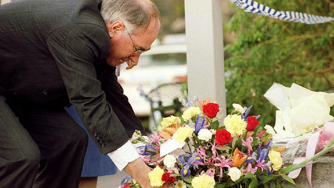 Then Prime Minister John Howard places a wreath at the steps of the Broad Arrow Cafe, the origin of the Port Arthur massacre.
