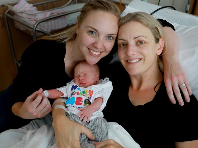 Proud parents Cassie and Fiona Falconer with son Callum. Picture: Angelo Velardo