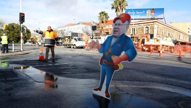 Substitute Ian Hunter at the burst water main on the corner of Morphett and Hindley streets in Adelaide’s CBD. Picture: Simon Cross