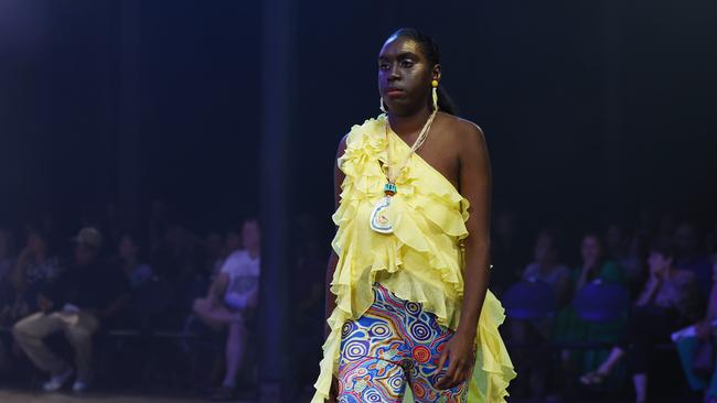 Renae Mooka showcases the Taking Shape collection from designer Elverina Johnson at the Cairns Indigenous Art Fair fashion performance, Woven, held at the Tanks Arts Centre, Edge Hill. Picture: Brendan Radke
