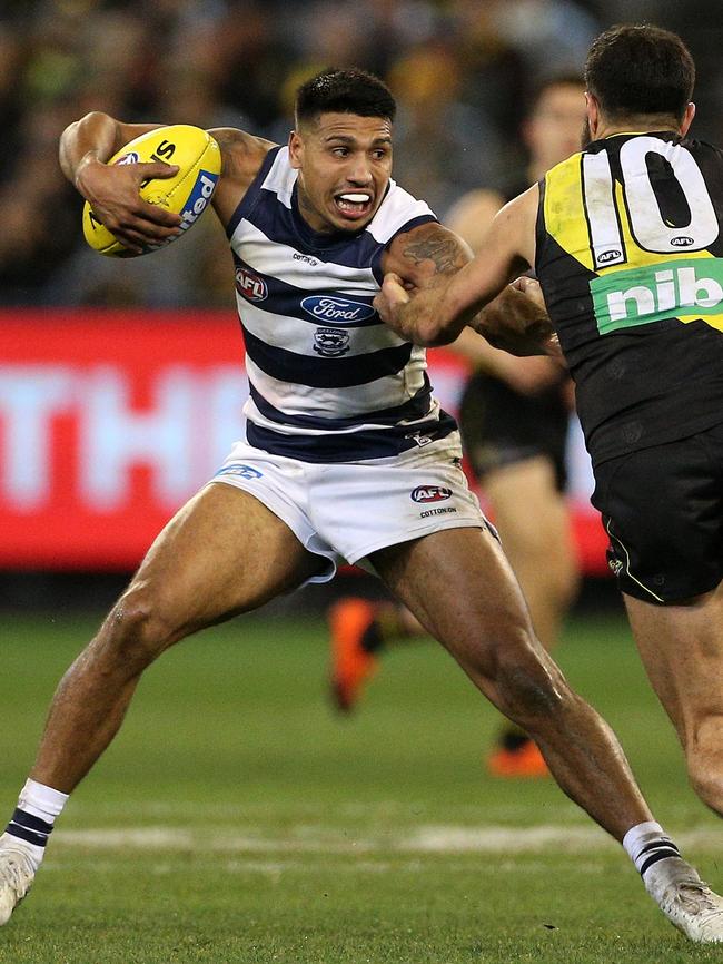 Geelong’s Tim Kelly fends off Richmond’s Shane Edwards. Picture: AAP Image/Hamish Blair